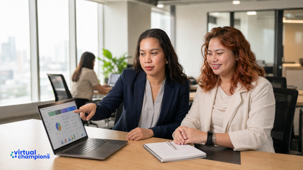 Virtual assistant and client reviewing delegated work together on a laptop using SOP standards
