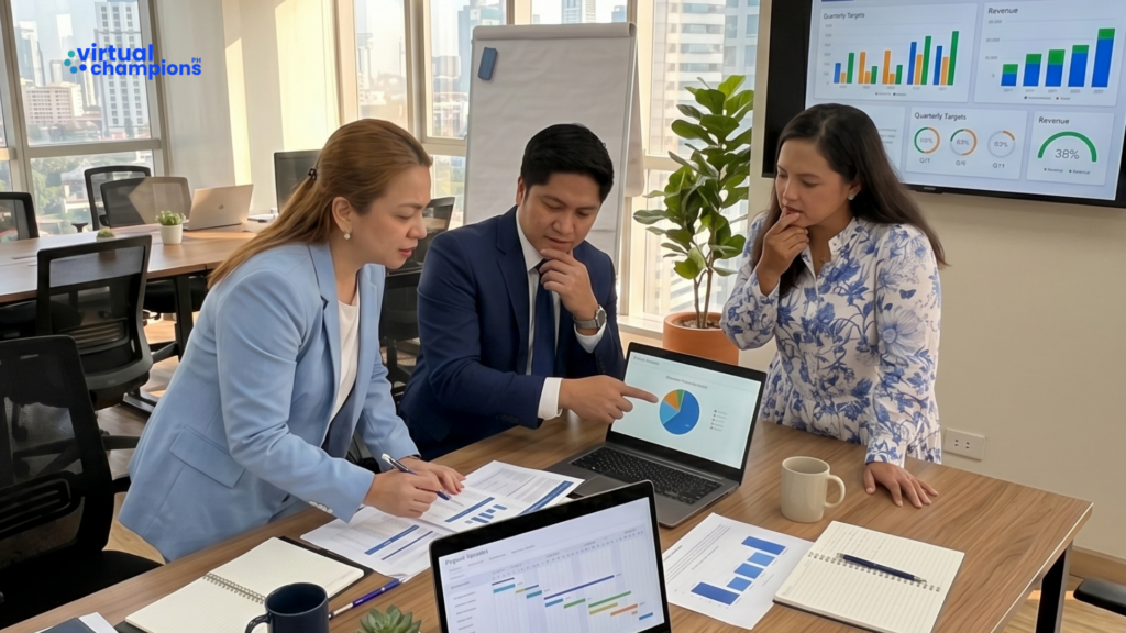 Small business team reviewing Q3 targets and revenue dashboards to build an operational system behind their plan